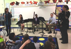 Flutist and clarinetist demonstrate instruments for students